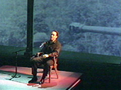 Roger talking about Vietnam with tank behind his head